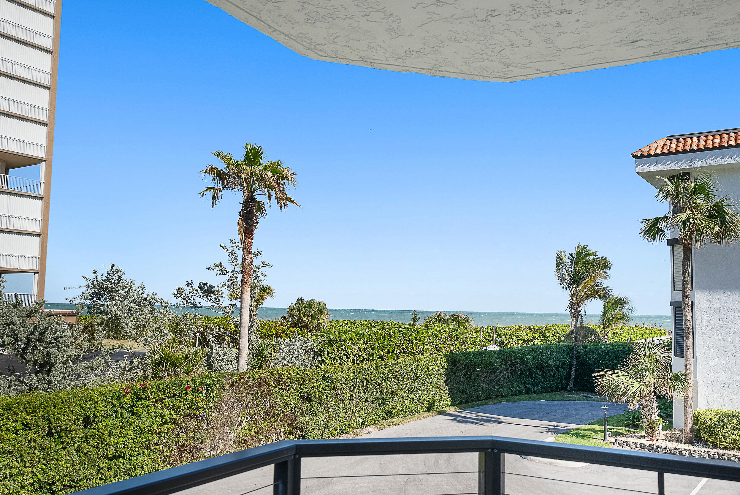 4100 North Hwy A1A, Unit 315 Hutchinson Island, FL 34949 - Photo 3 of 41 a view of a garden from a balcony