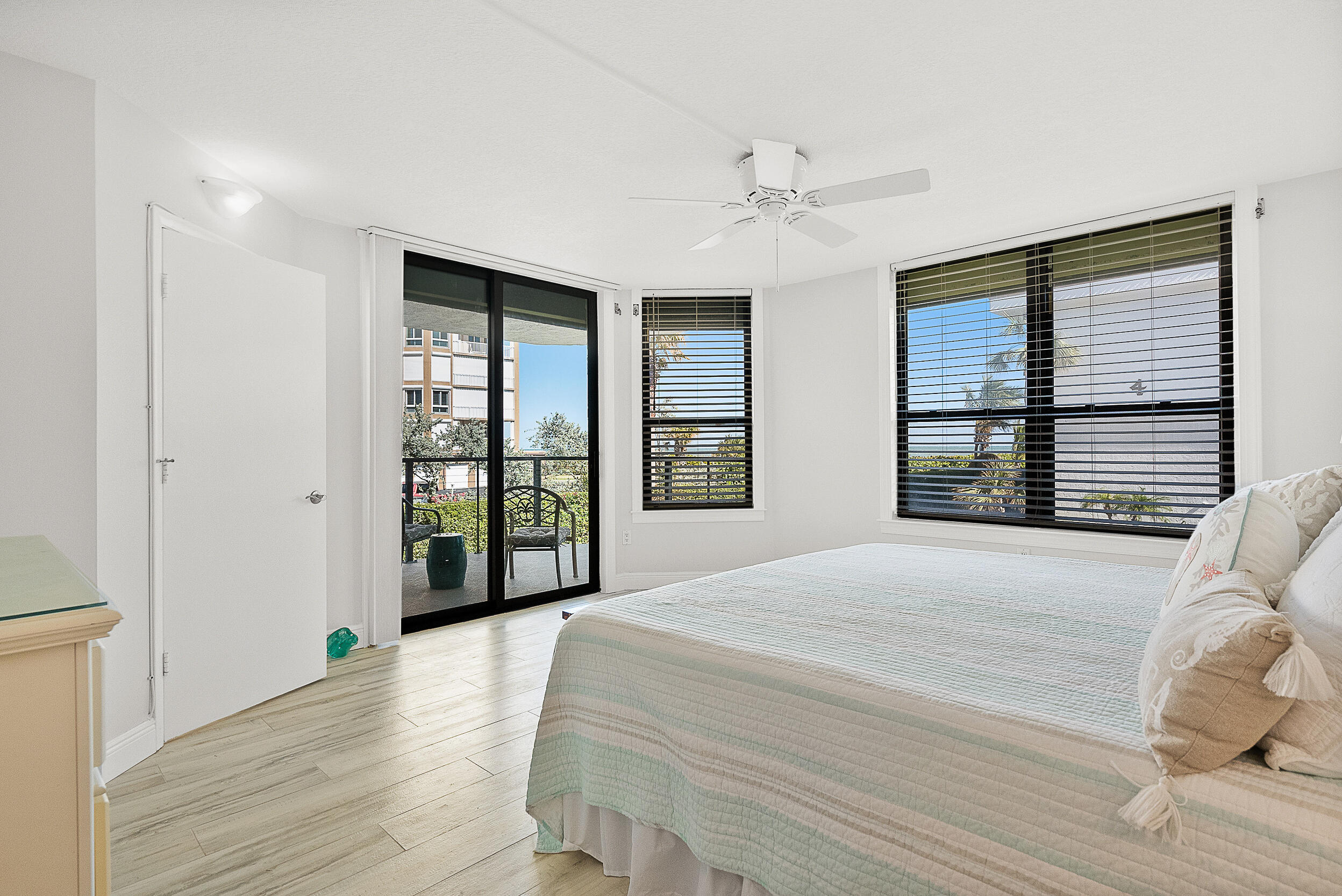 4100 North Hwy A1A, Unit 315 Hutchinson Island, FL 34949 - Photo 10 of 41 a spacious bedroom with a large bed and wooden floor