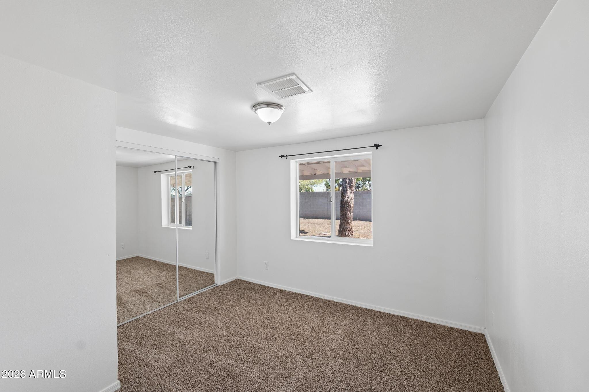 7 South Catalina Street Gilbert, AZ 85233 - Photo 25 of 34 an empty room with windows and closet
