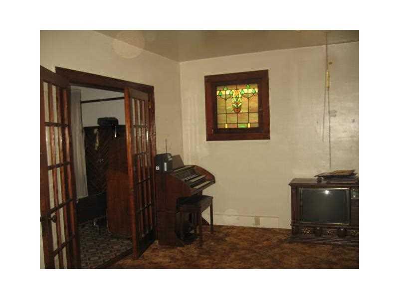 Living Room. 15x15 2 stained glass windows French doors