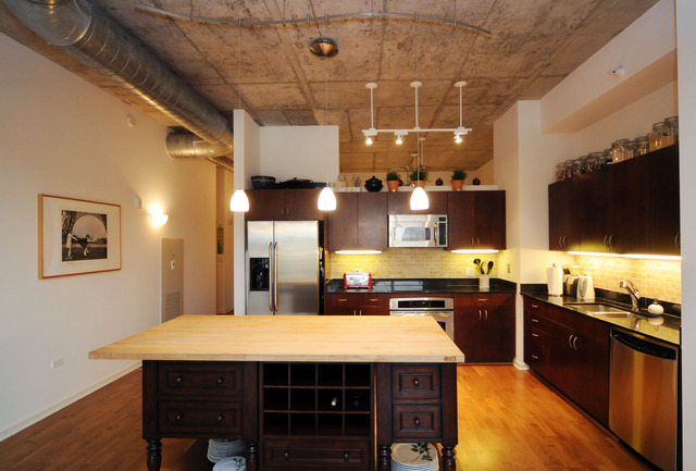 807 Davis Street, Unit 512 Evanston, IL 60201 - Photo 2 of 23 a large kitchen with lots of counter space and stainless steel appliances