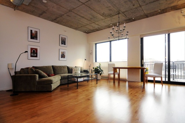 807 Davis Street, Unit 512 Evanston, IL 60201 - Photo 4 of 23 a living room with furniture and large windows