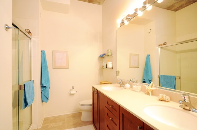 807 Davis Street, Unit 512 Evanston, IL 60201 - Photo 7 of 23 a bathroom with a granite countertop sink and a mirror