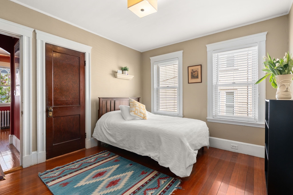 45 Springfield Street, Unit 1 Belmont, MA 02478 - Photo 15 of 27 a bedroom with a bed and a window
