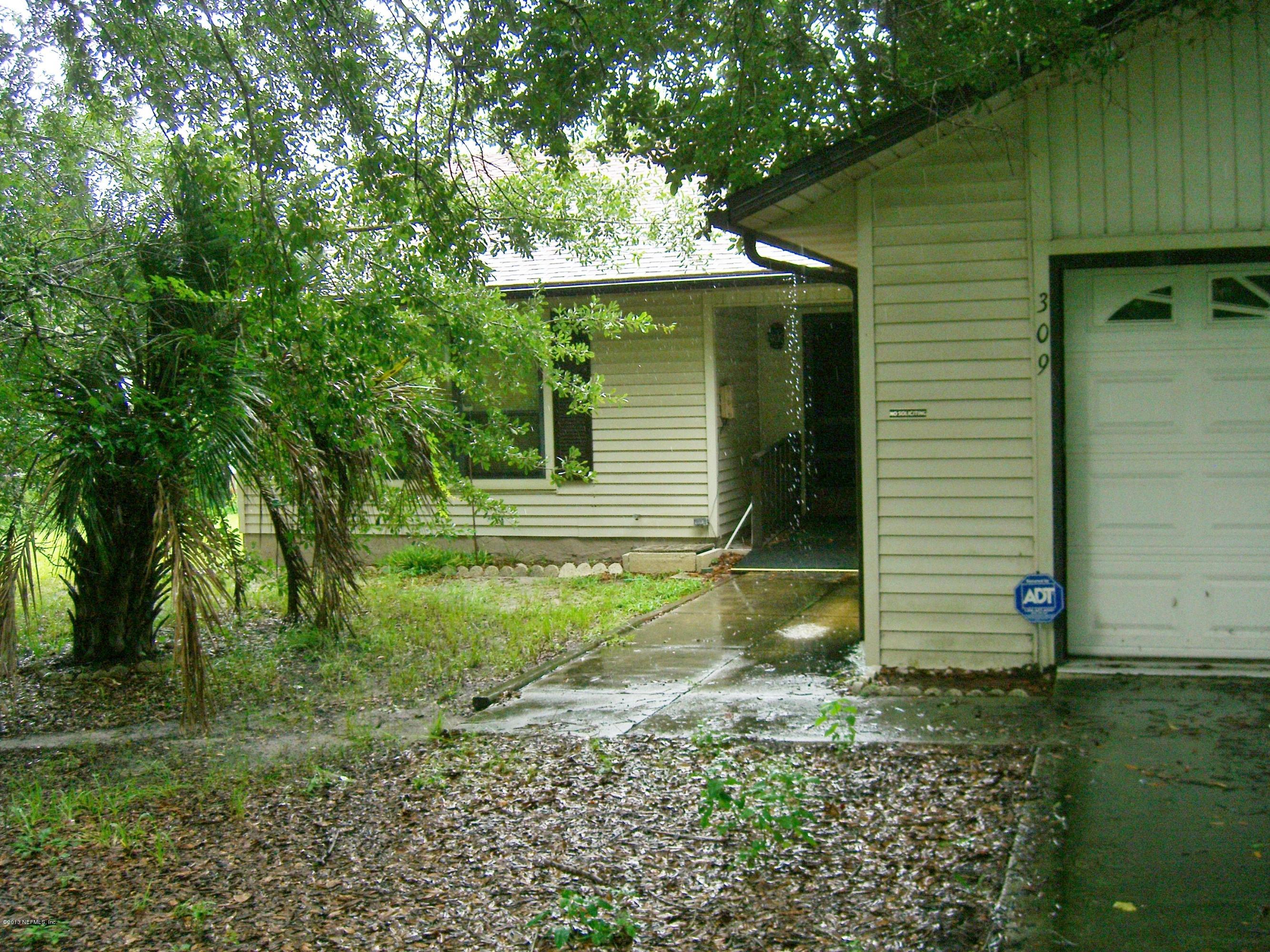 309 Royal Road St. Augustine, FL 32086 - Photo 1 of 5 a view of a house with a yard