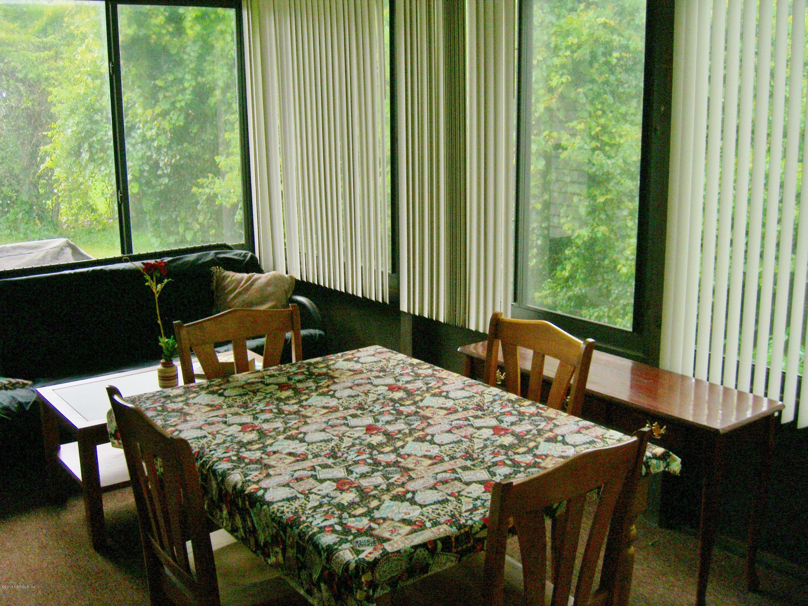 309 Royal Road St. Augustine, FL 32086 - Photo 2 of 5 a view of a dining room with furniture window and outside view