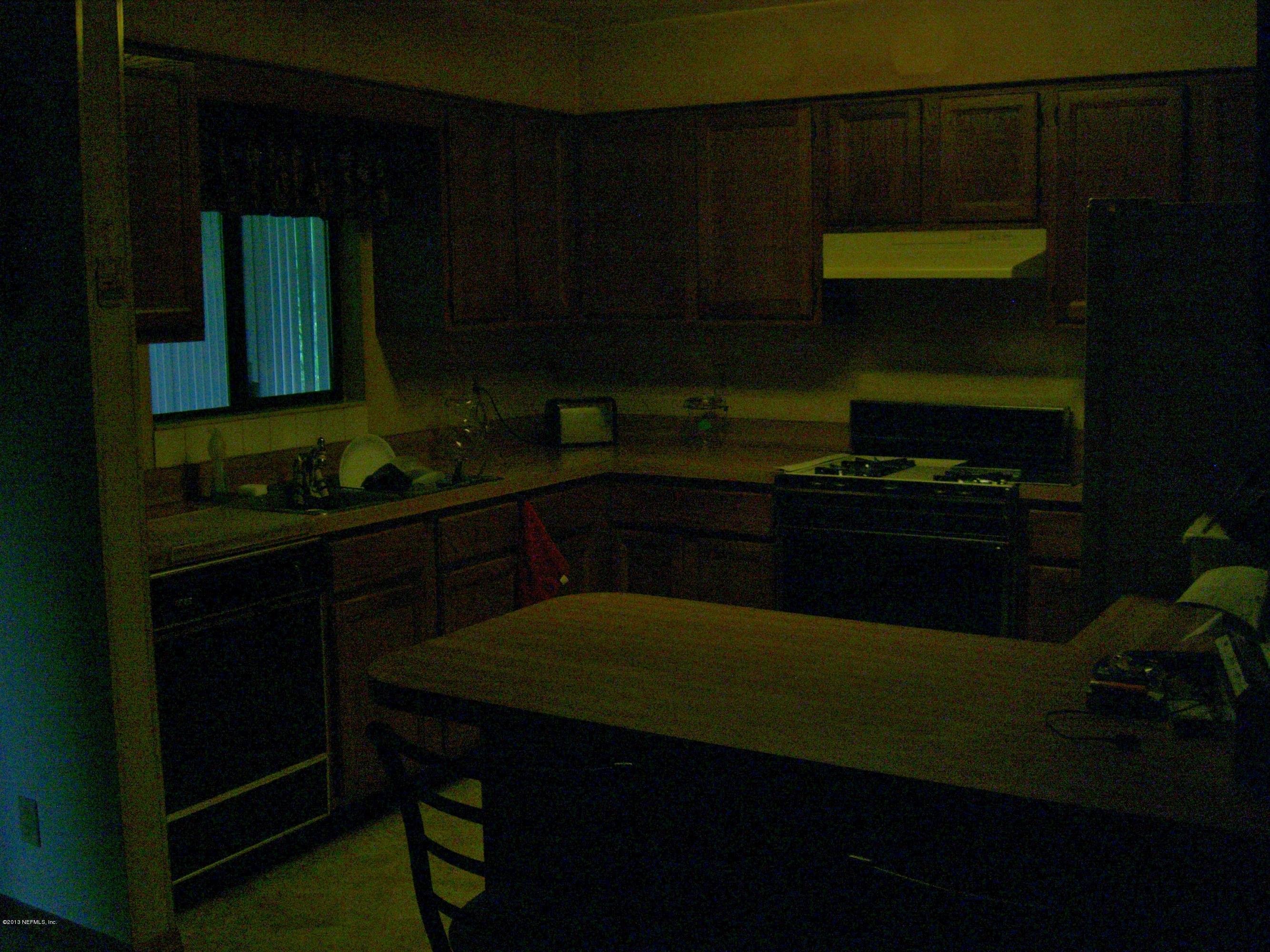 309 Royal Road St. Augustine, FL 32086 - Photo 5 of 5 a kitchen with a cabinets and appliances
