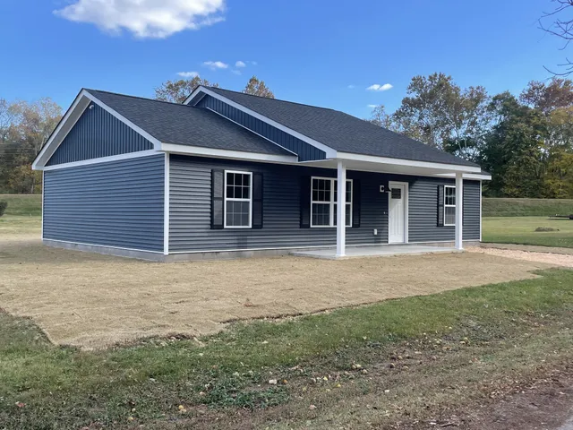 a house with yard in front of it
