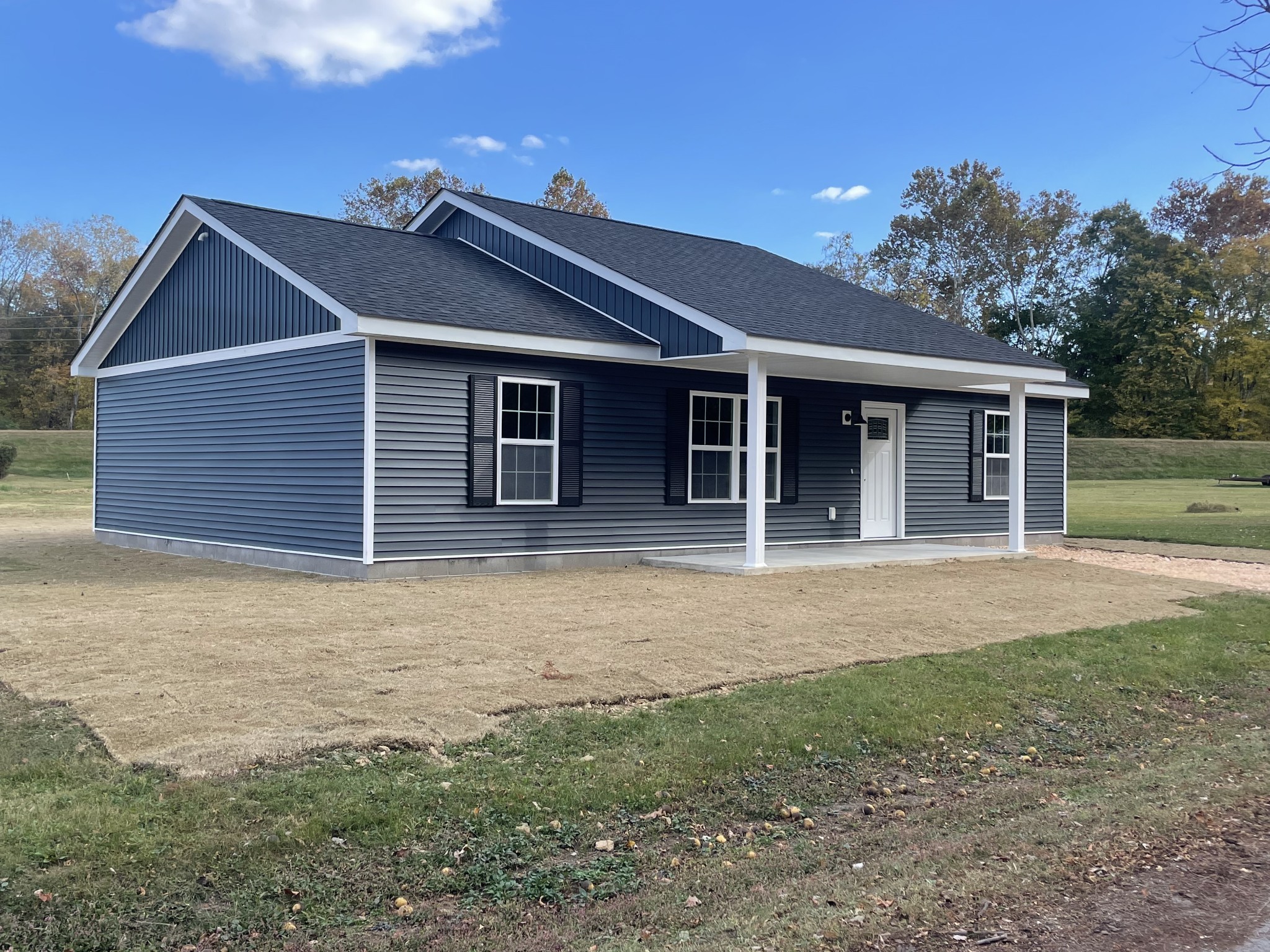 a house with yard in front of it