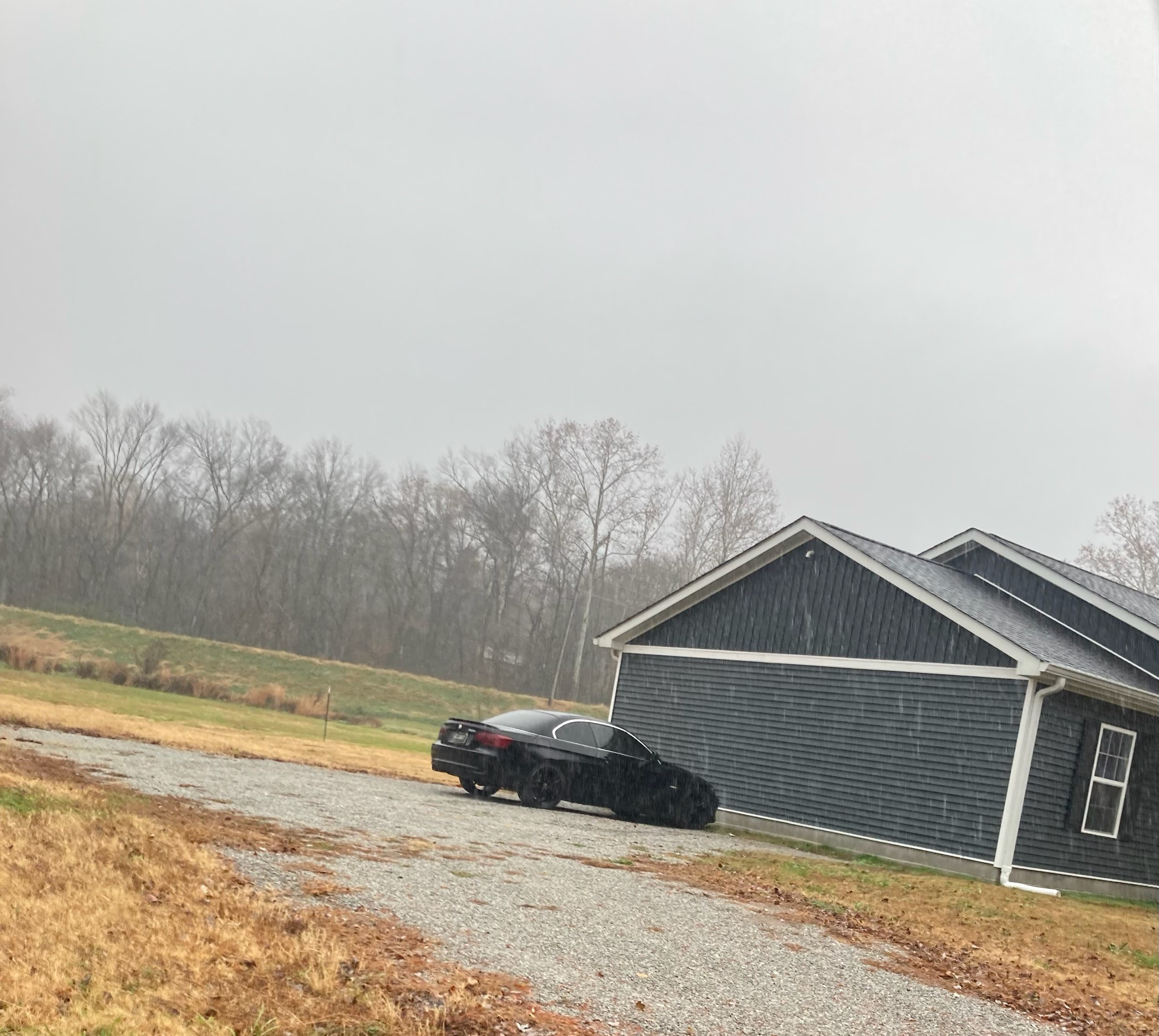 110 Water Street Big Sandy, TN 38221 - Photo 9 of 14 a front view of a house with a yard and garage