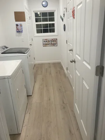 a view of a storage & utility room with a window