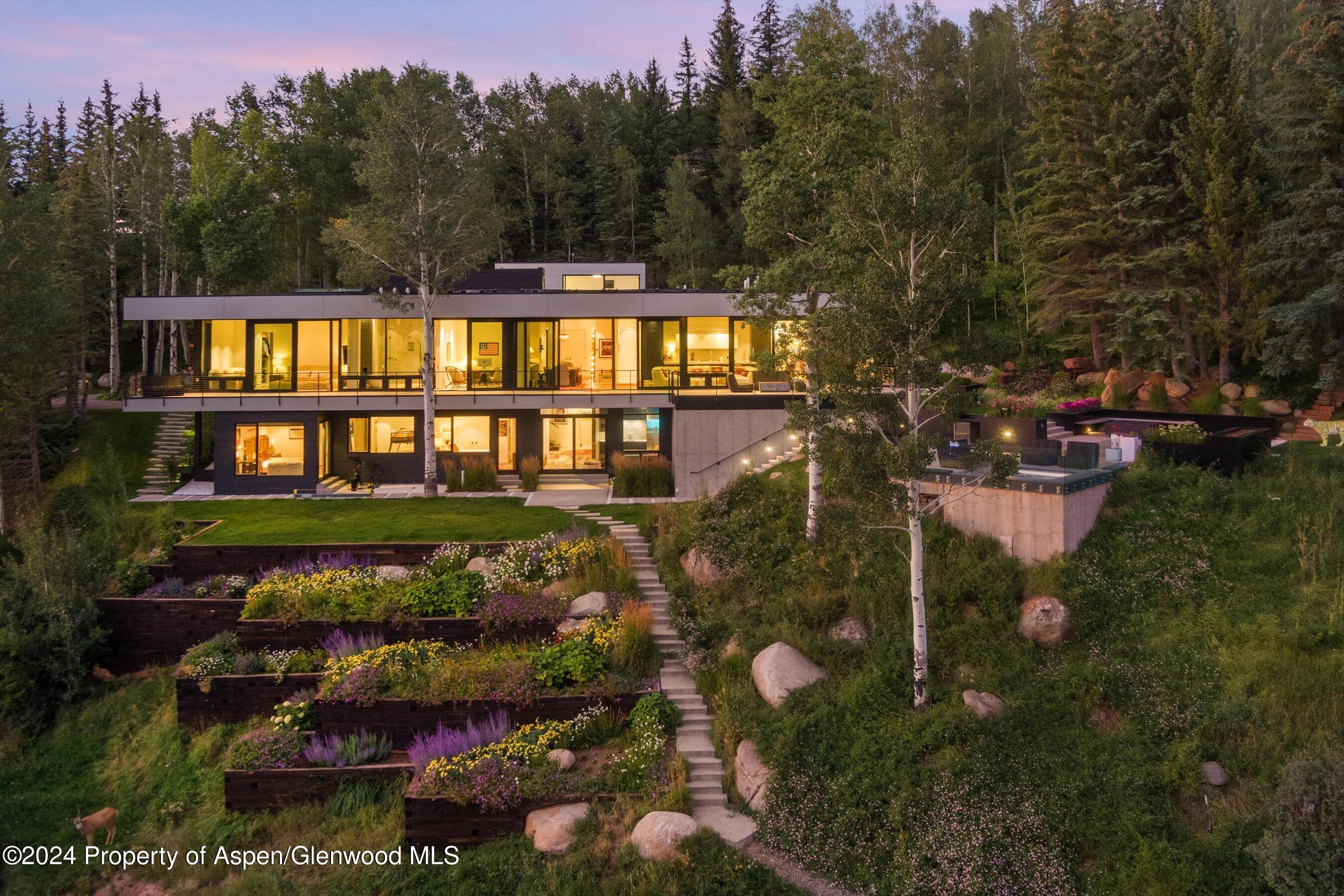 a view of a brick house with a yard