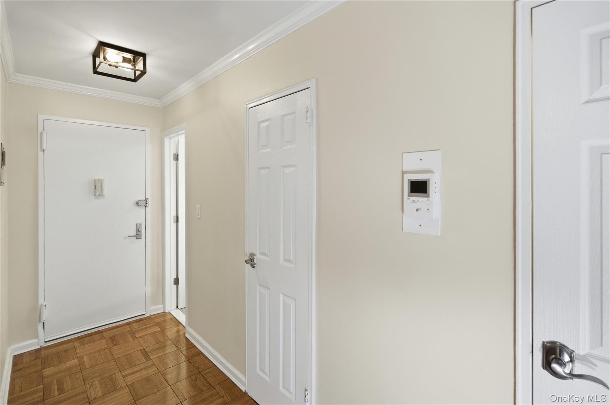 25 Chapel Place, Unit 1B Great Neck, NY 11021 - Photo 2 of 33 a view of a hallway with closet