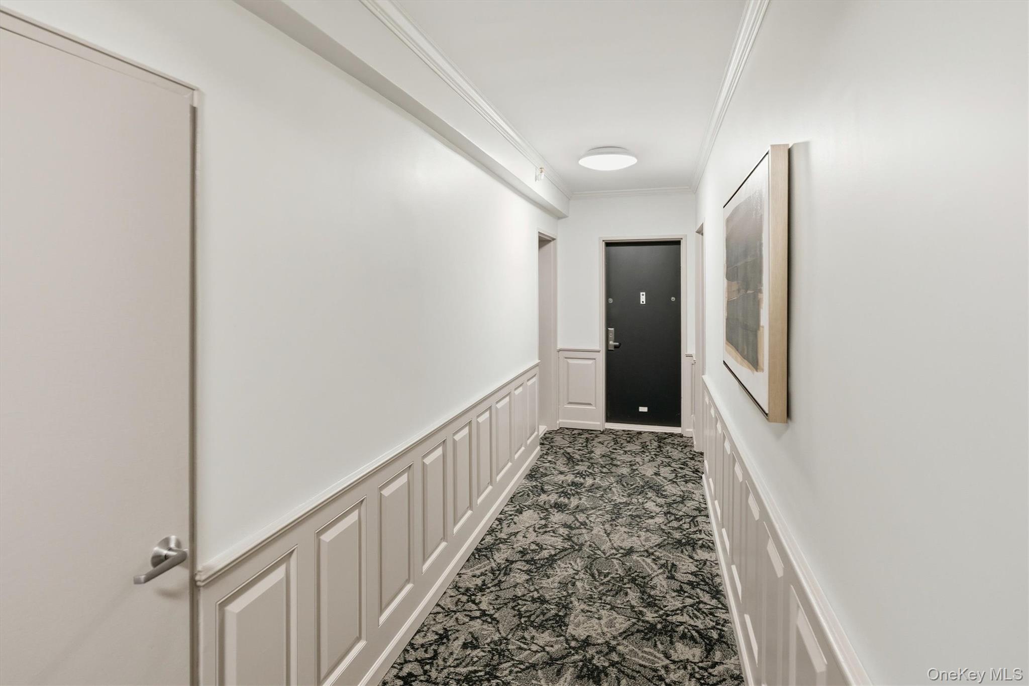 25 Chapel Place, Unit 1B Great Neck, NY 11021 - Photo 21 of 33 a view of a hallway view with staircase