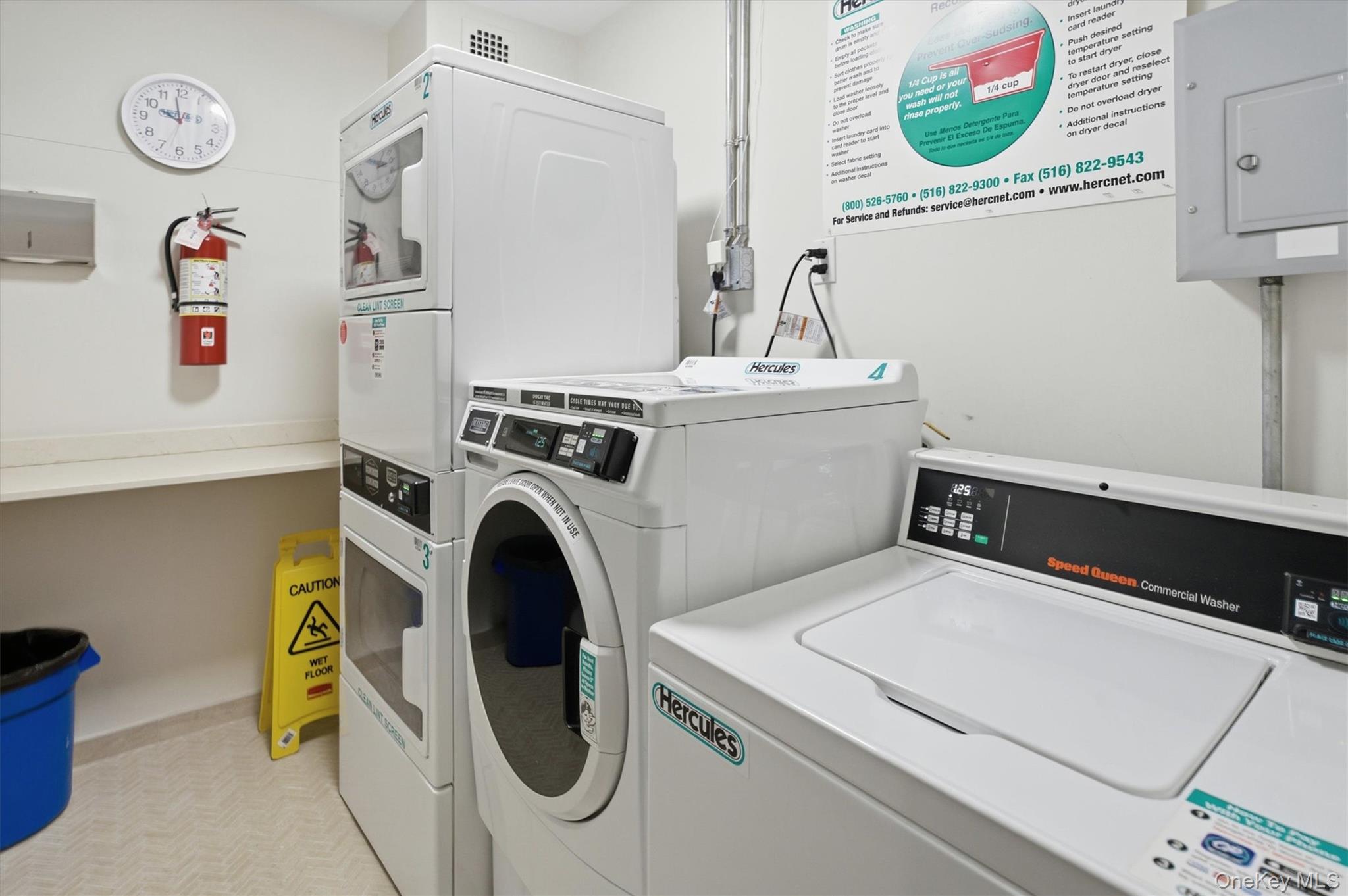 25 Chapel Place, Unit 1B Great Neck, NY 11021 - Photo 29 of 33 a utility room with dryer and washer