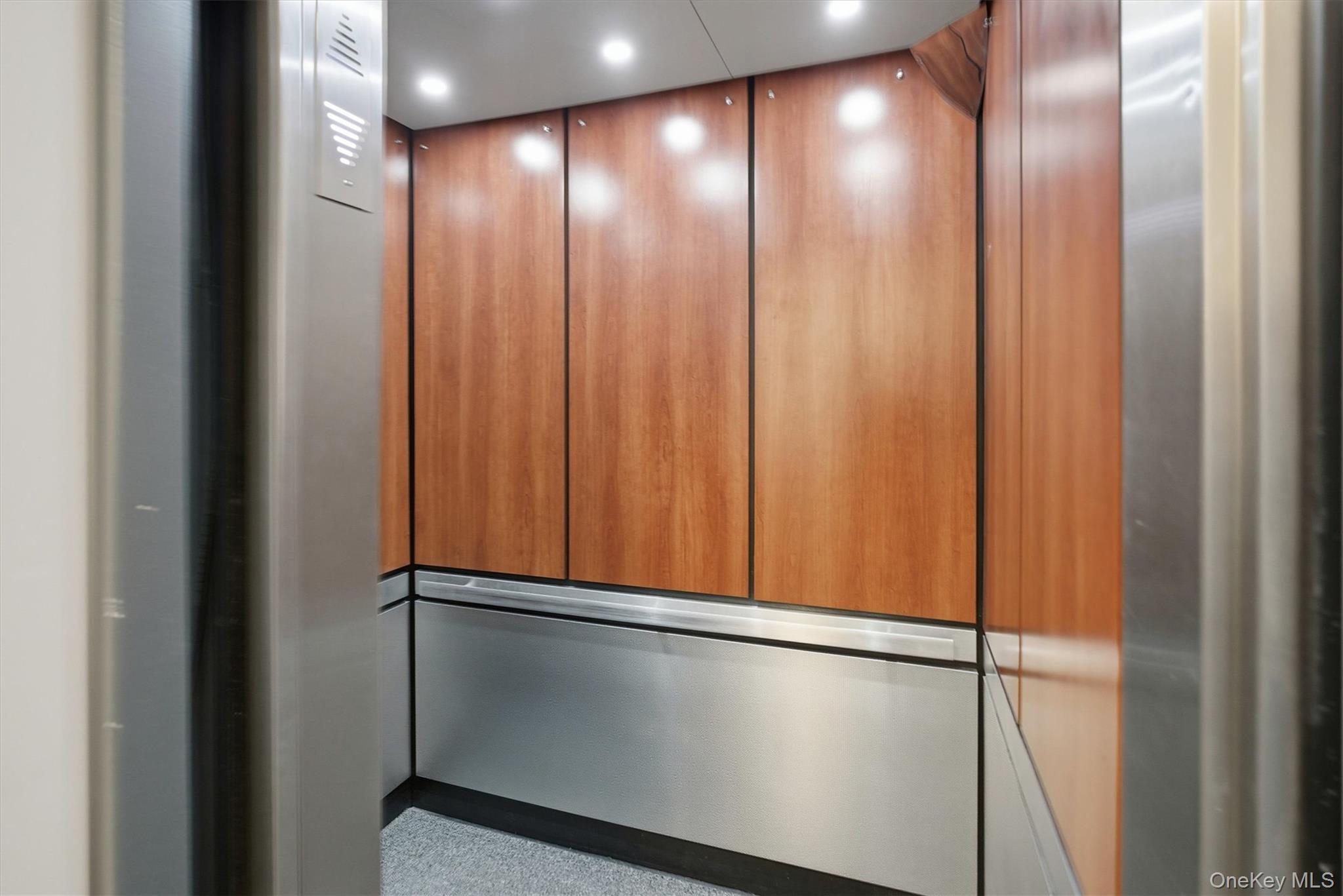 25 Chapel Place, Unit 1B Great Neck, NY 11021 - Photo 32 of 33 a view of a room with a wooden walls