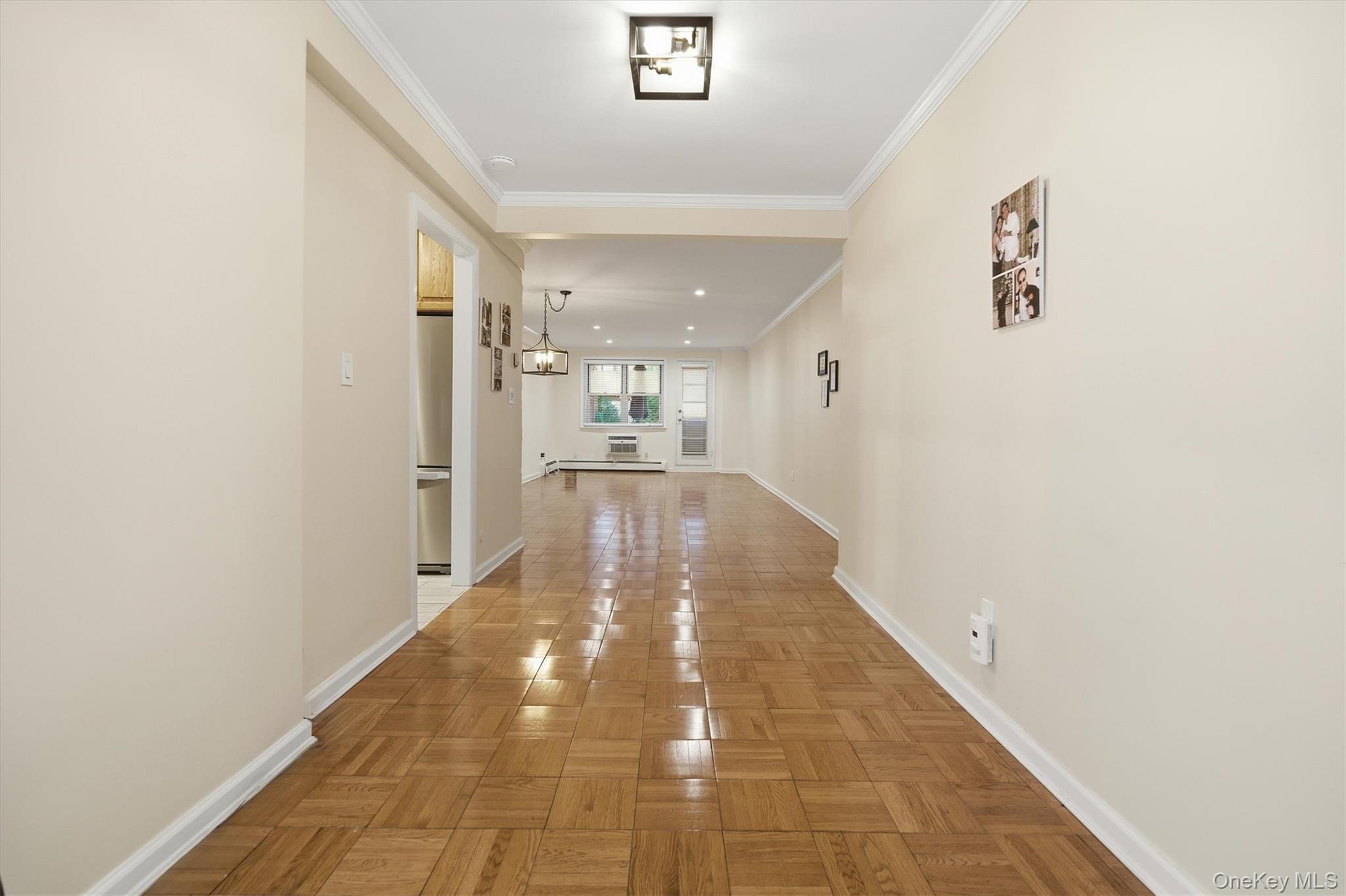25 Chapel Place, Unit 1B Great Neck, NY 11021 - Photo 6 of 33 a view of a hallway with a window