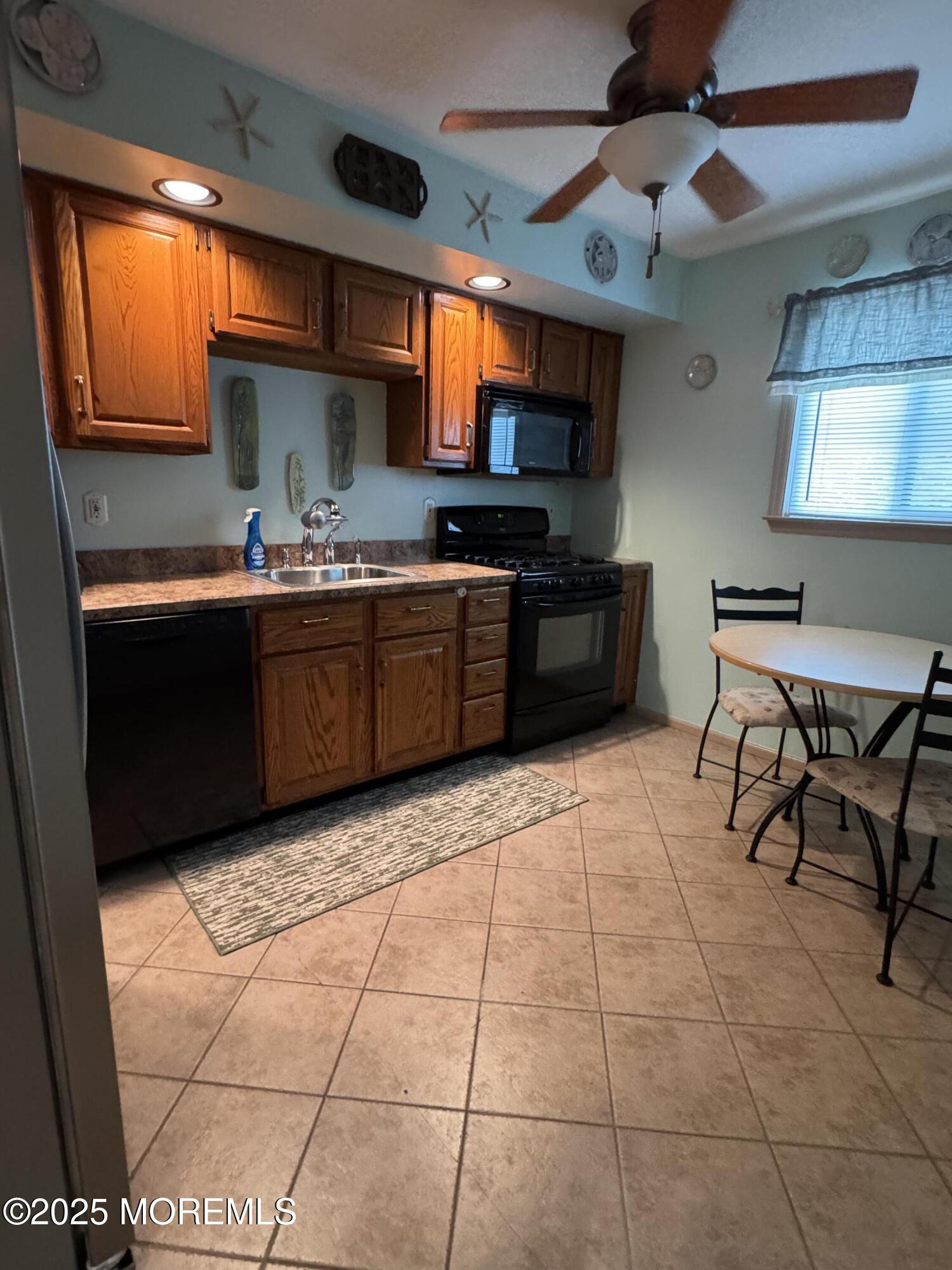 1208 Alpine Trail Neptune Township, NJ 07753 - Photo 15 of 29 a kitchen with stainless steel appliances granite countertop a sink and a stove