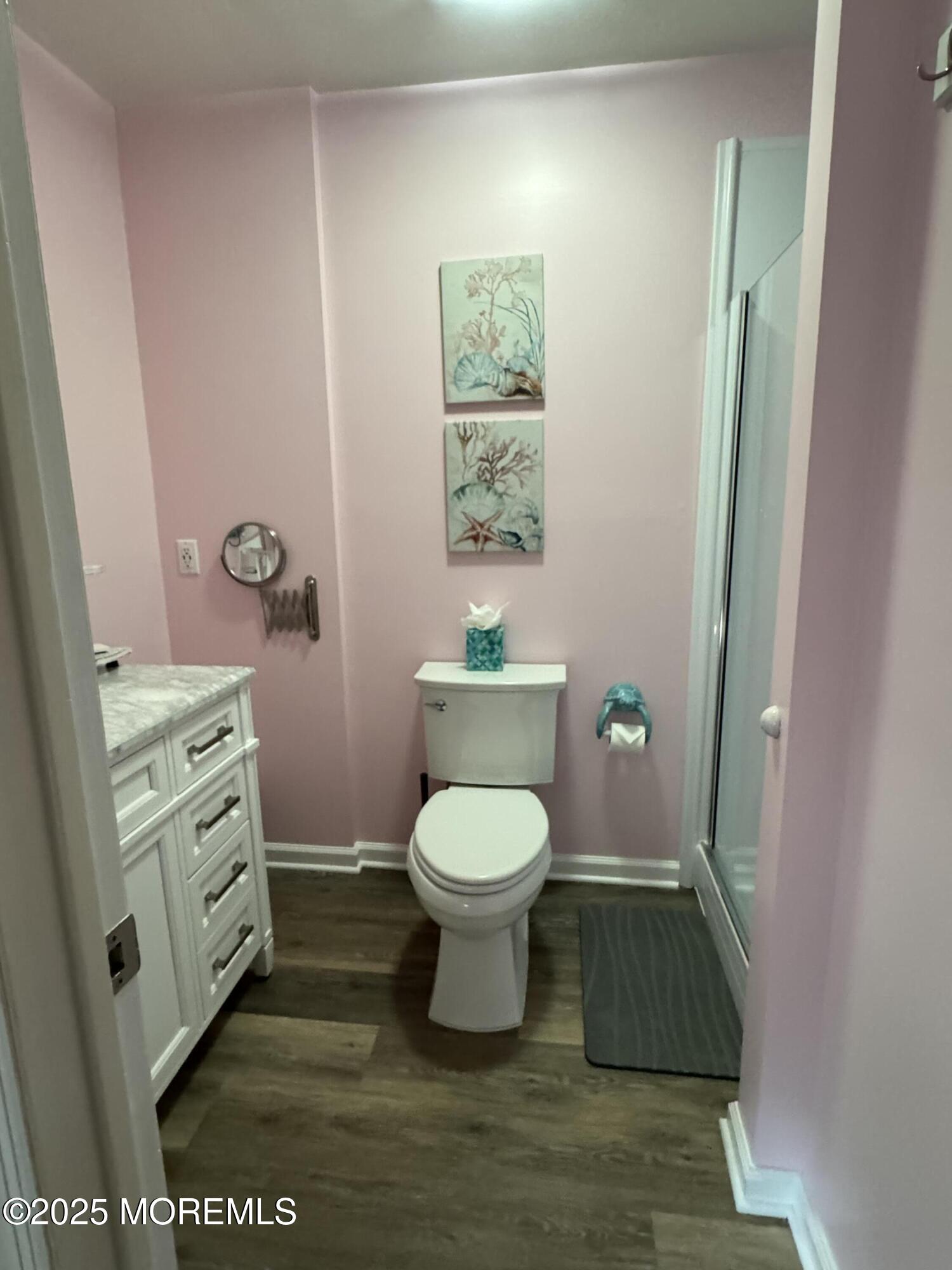 1208 Alpine Trail Neptune Township, NJ 07753 - Photo 19 of 29 a bathroom with a toilet a sink and a mirror
