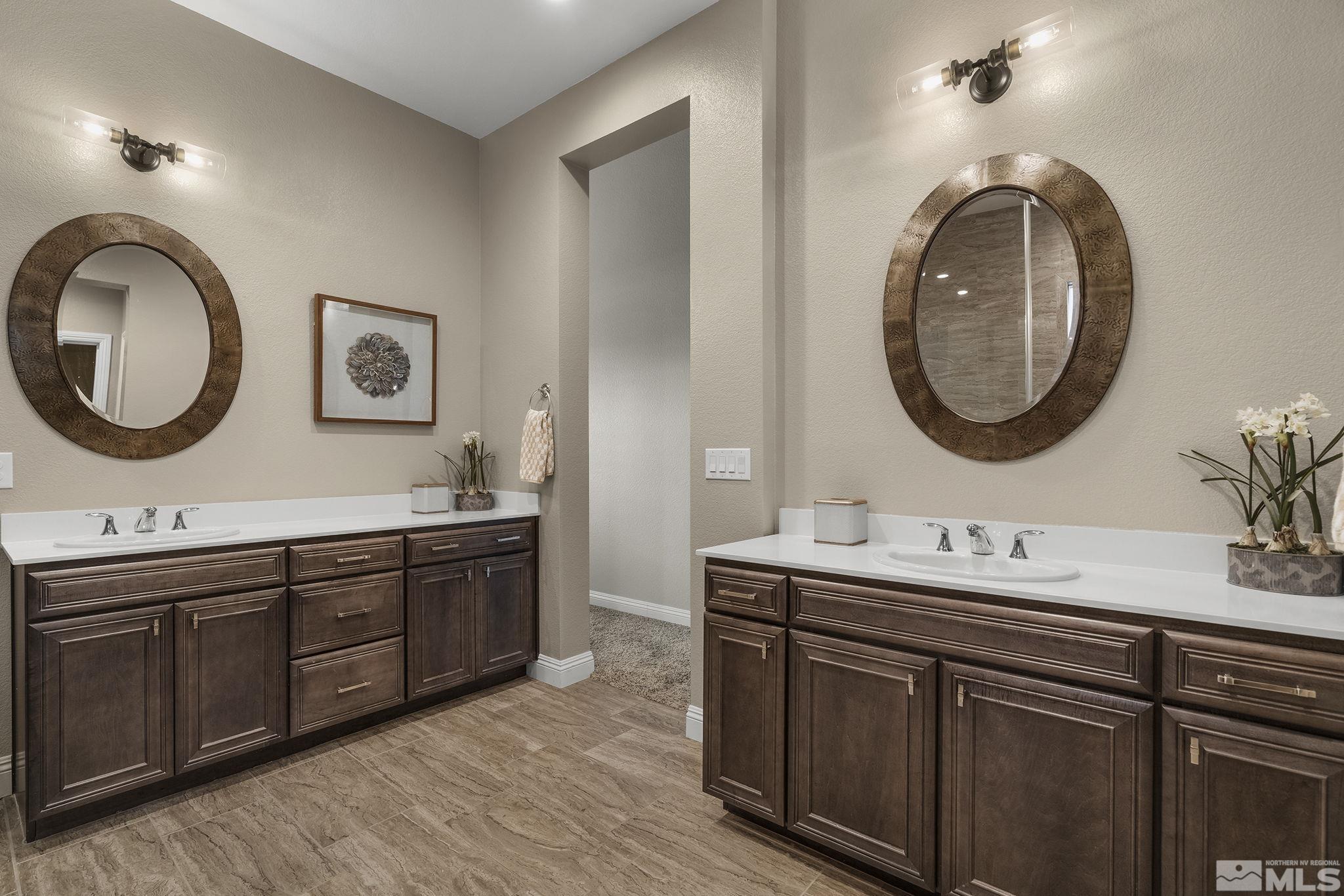 2455 Buttermere Court Reno, NV 89521 - Photo 18 of 38 a bathroom with a double vanity sink and a mirror