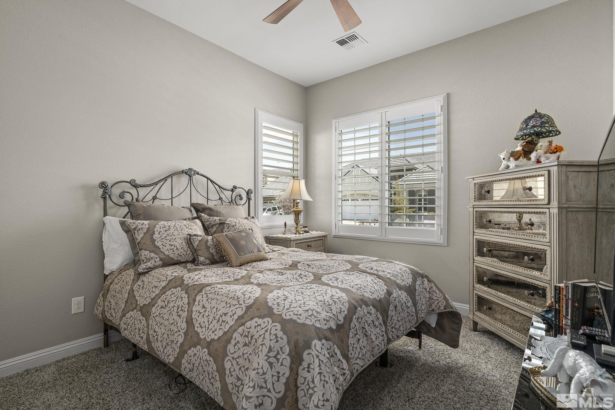2455 Buttermere Court Reno, NV 89521 - Photo 20 of 38 a bedroom with a bed and a window