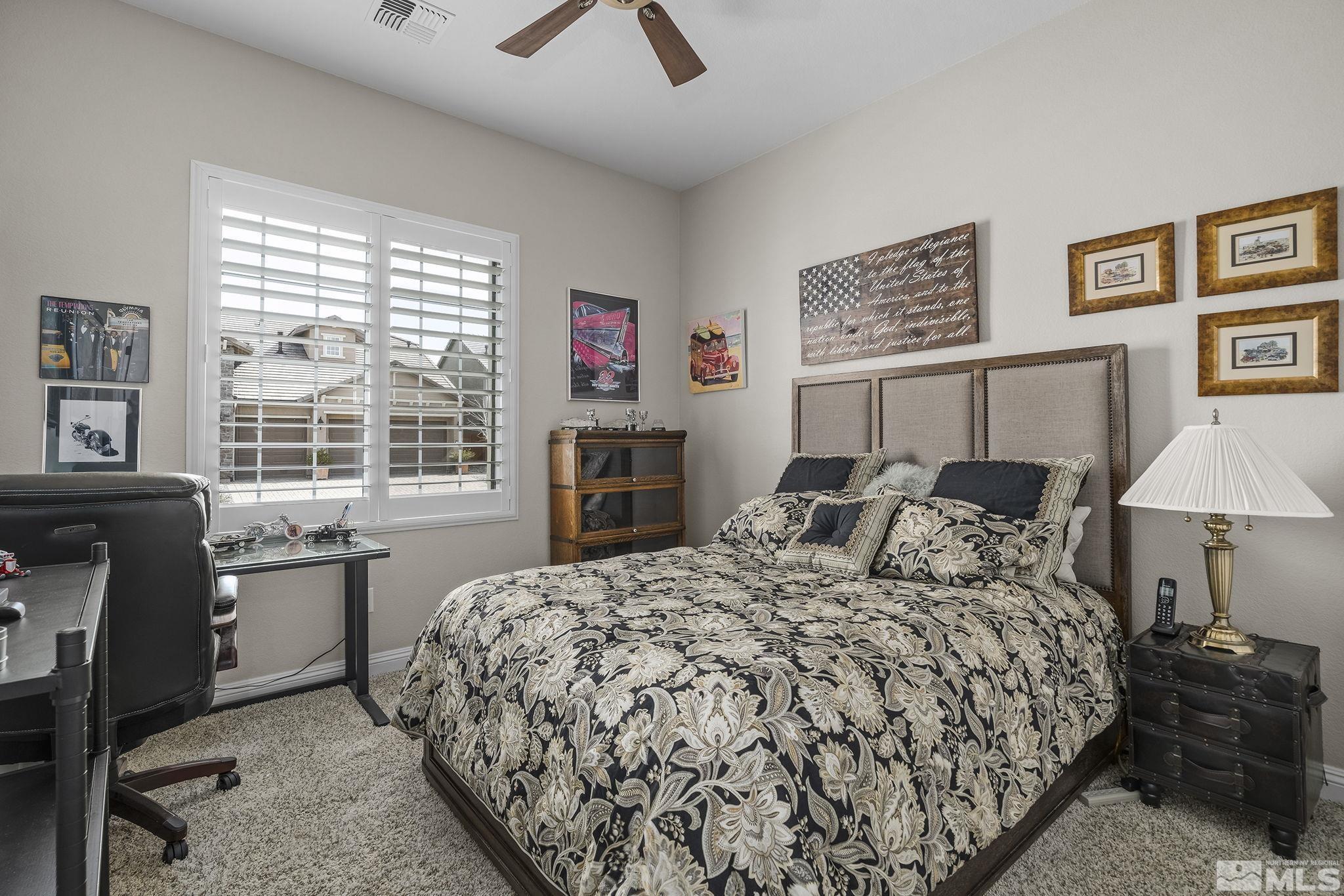 2455 Buttermere Court Reno, NV 89521 - Photo 21 of 38 a bed sitting in a bedroom next to a window