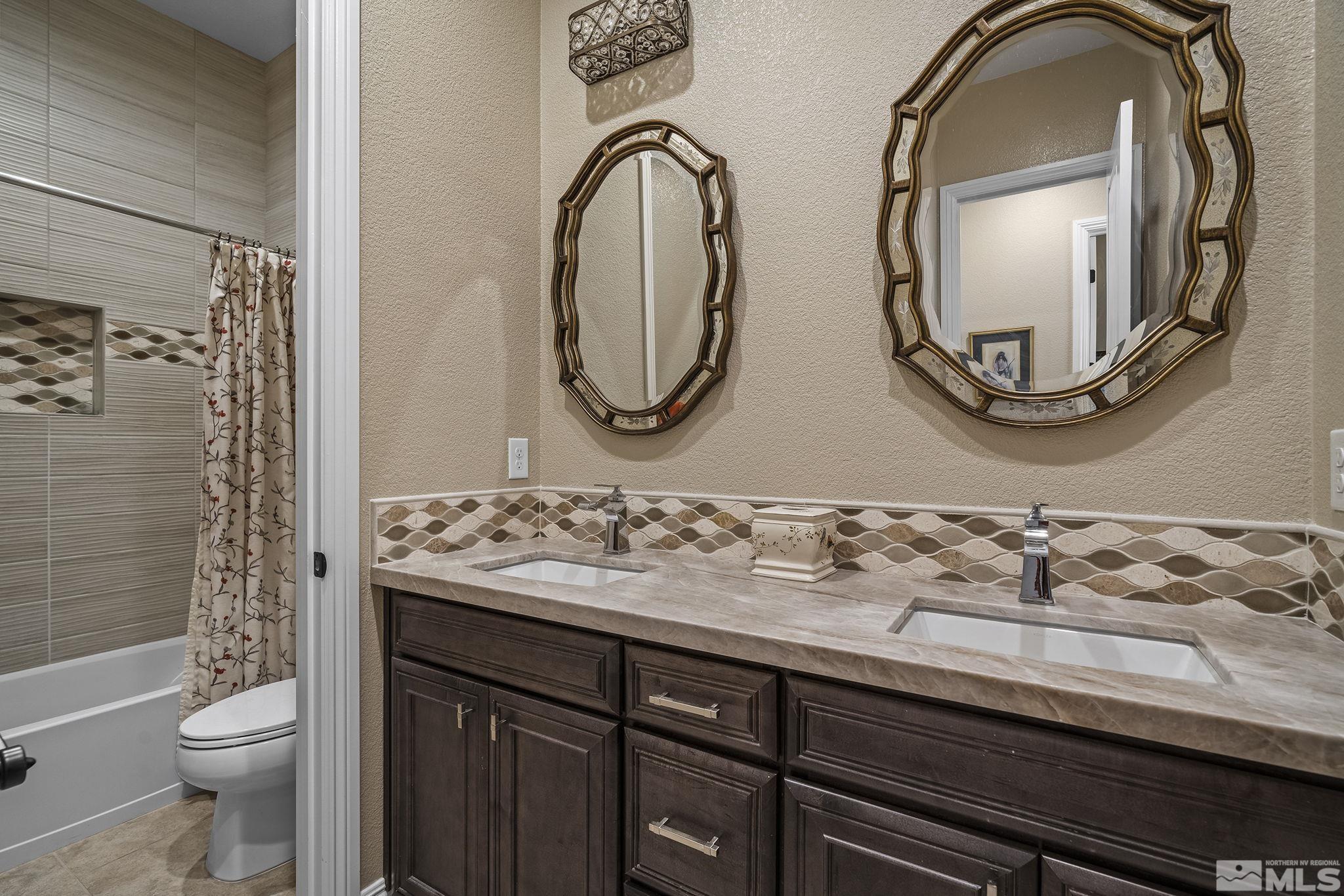 2455 Buttermere Court Reno, NV 89521 - Photo 22 of 38 a bathroom with a sink and a mirror
