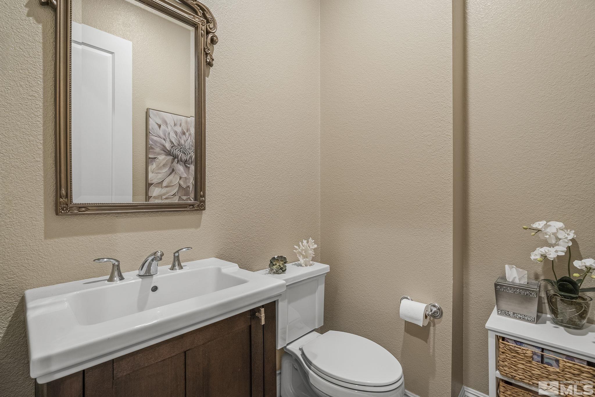 2455 Buttermere Court Reno, NV 89521 - Photo 24 of 38 a bathroom with a sink vanity and a toilet