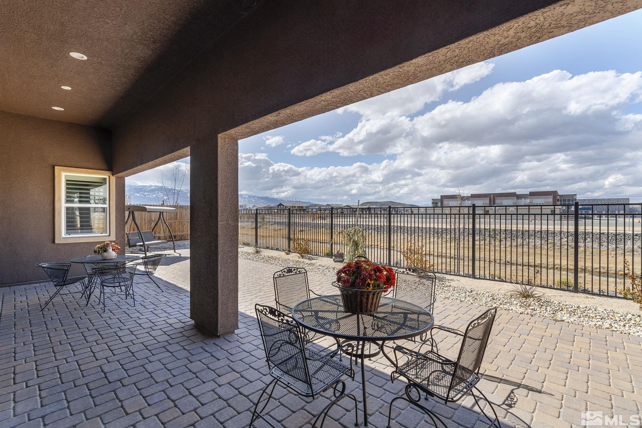 2455 Buttermere Court Reno, NV 89521 - Photo 25 of 38 a view of a balcony with dining table and chairs
