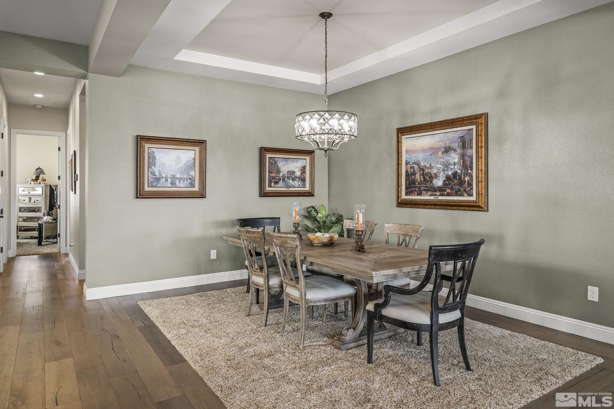 2455 Buttermere Court Reno, NV 89521 - Photo 5 of 38 a view of a dining room with furniture wooden floor and a chandelier