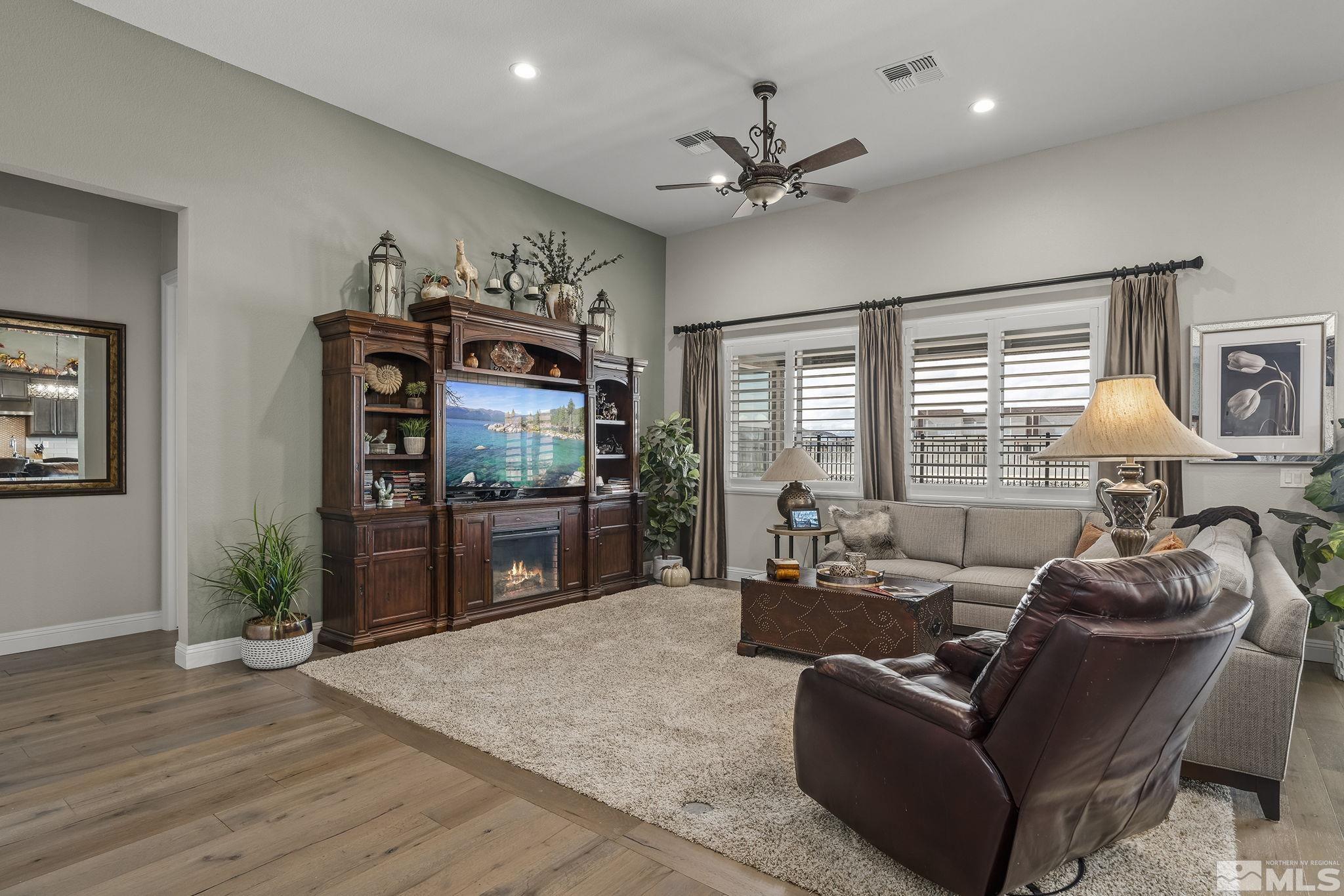 2455 Buttermere Court Reno, NV 89521 - Photo 6 of 38 a living room with furniture and a flat screen tv