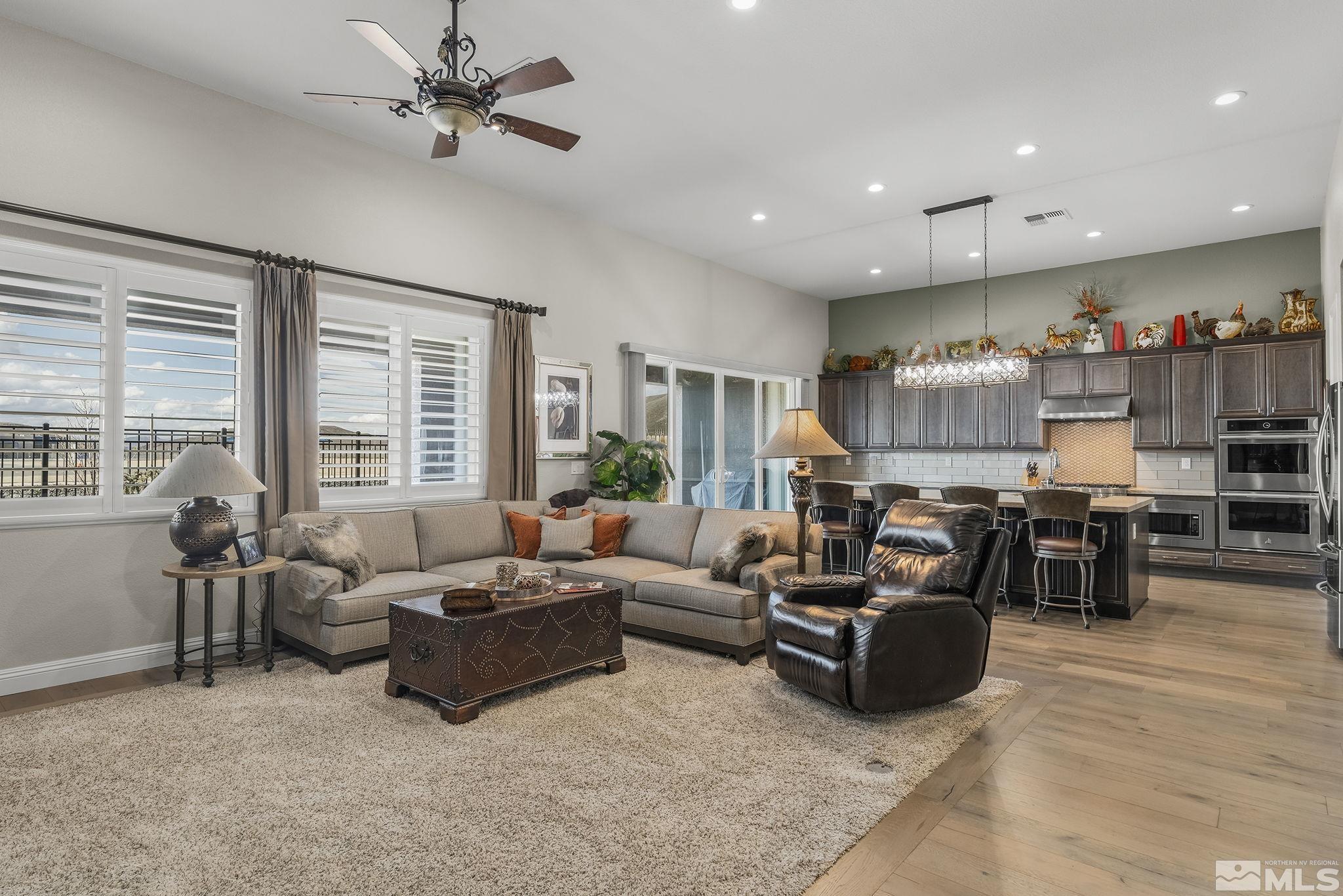 2455 Buttermere Court Reno, NV 89521 - Photo 7 of 38 a living room with furniture ceiling fan and a large window