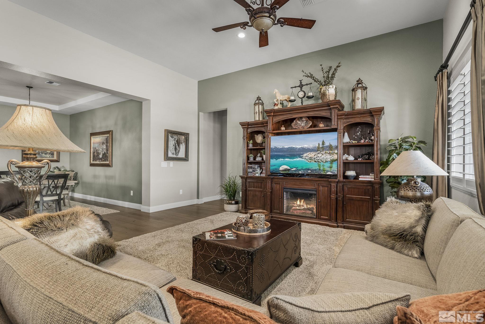 2455 Buttermere Court Reno, NV 89521 - Photo 8 of 38 a living room with furniture and a flat screen tv