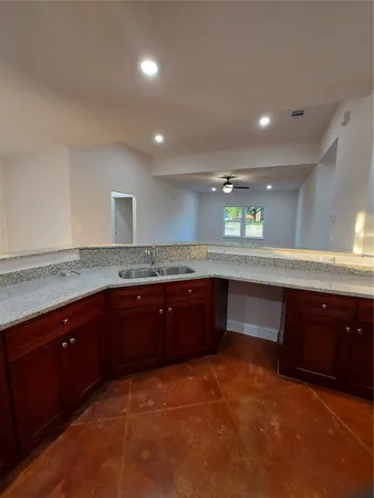 a kitchen with a sink and cabinets