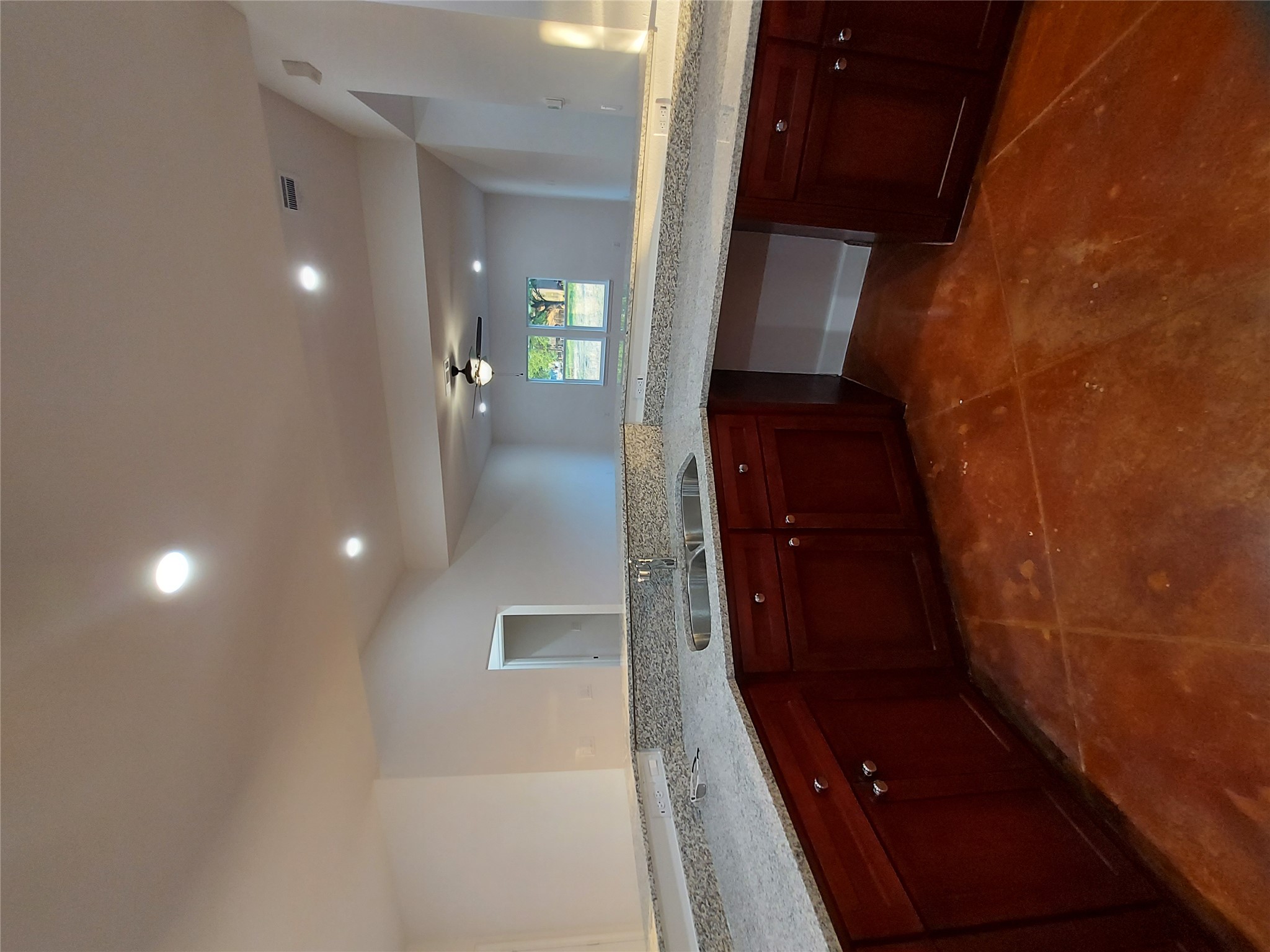 121 Spanish Oak Trail Cameron, TX 76520 - Photo 16 of 36 a kitchen with a sink and cabinets