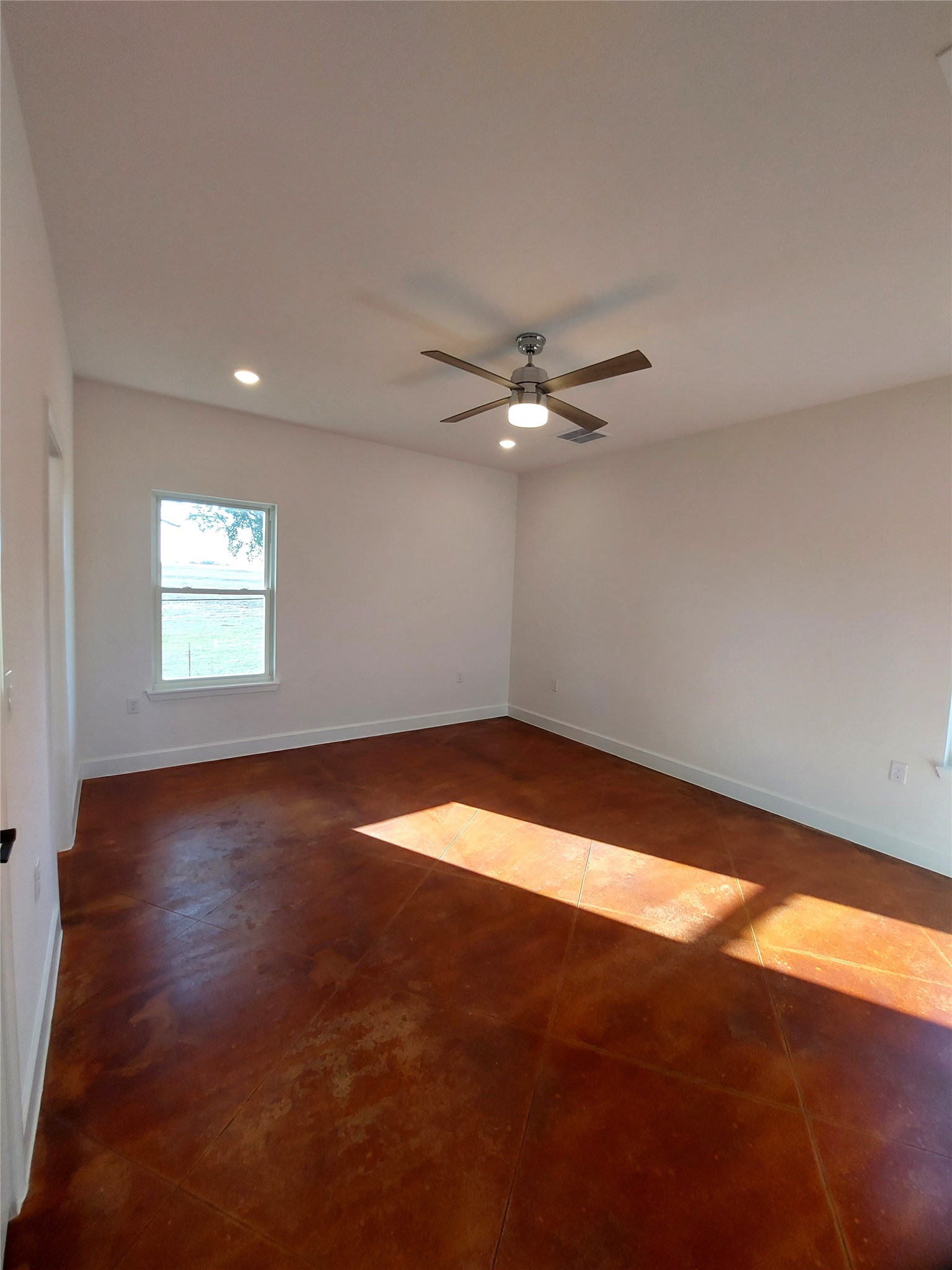 121 Spanish Oak Trail Cameron, TX 76520 - Photo 27 of 36 a view of an empty room with wooden floor and a window