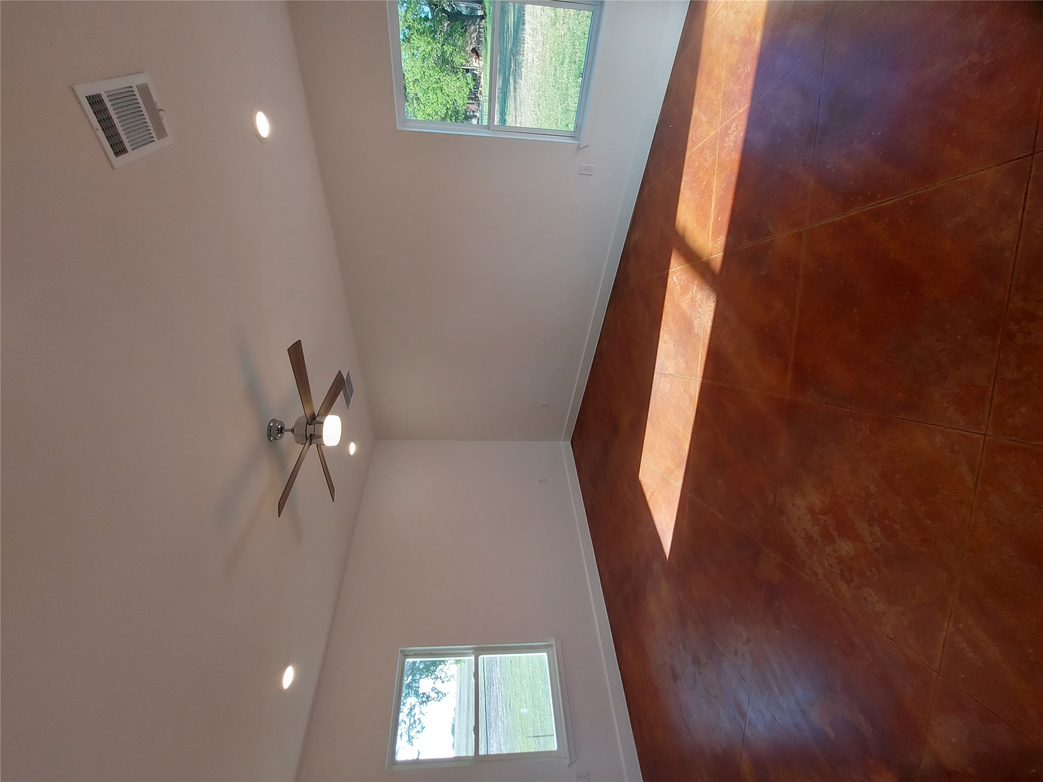 121 Spanish Oak Trail Cameron, TX 76520 - Photo 28 of 36 an empty room with a fan & windows