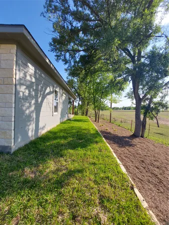 a view of yard with patio