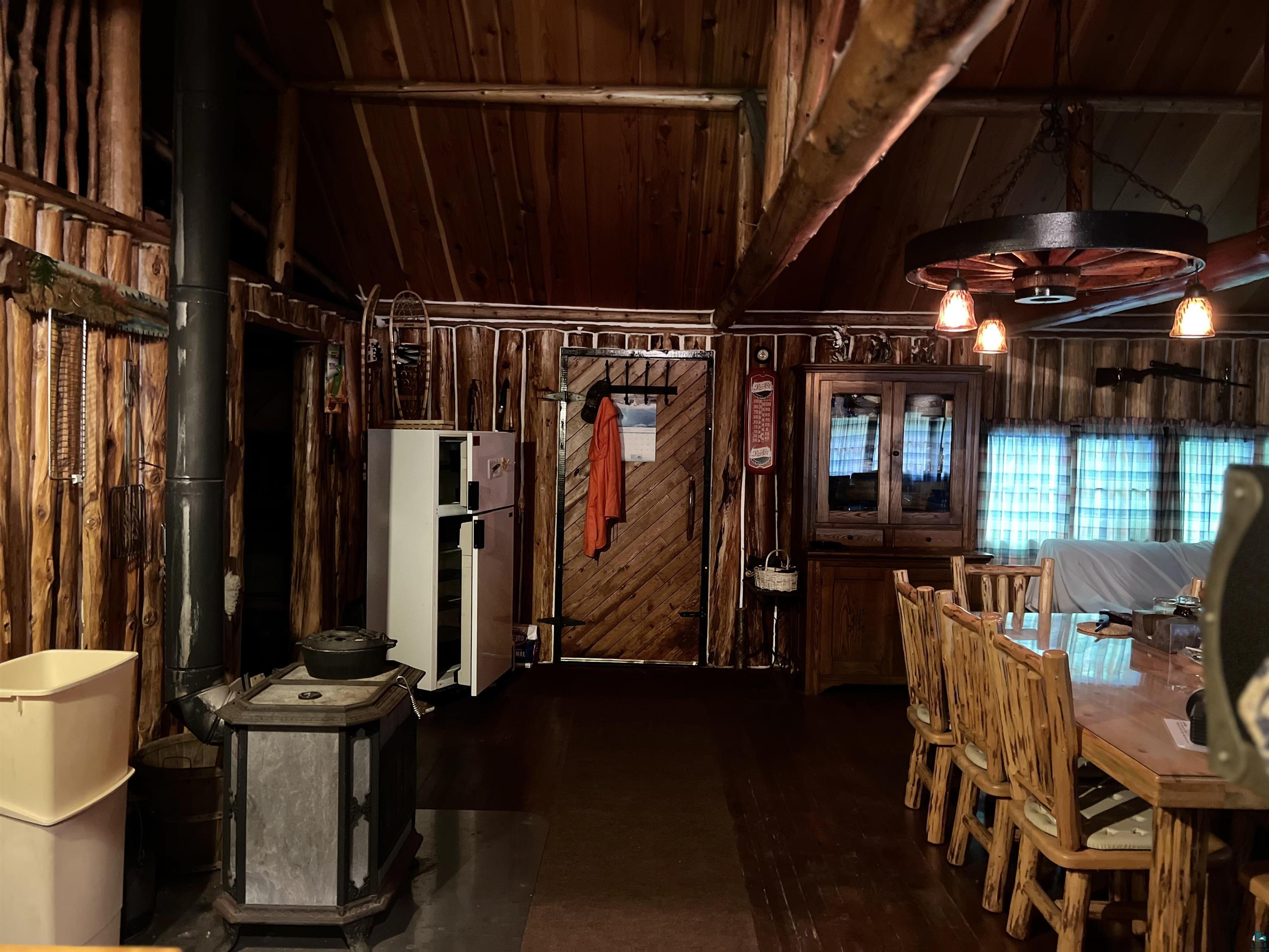 26336 Forest Road 181 Glidden, WI 54527 - Photo 14 of 18 Dining space with vaulted ceiling and wooden ceiling