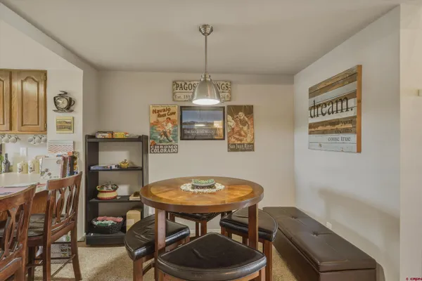 a view of a dining room with furniture