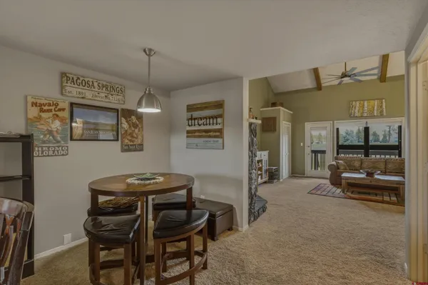 a dining room with furniture and window