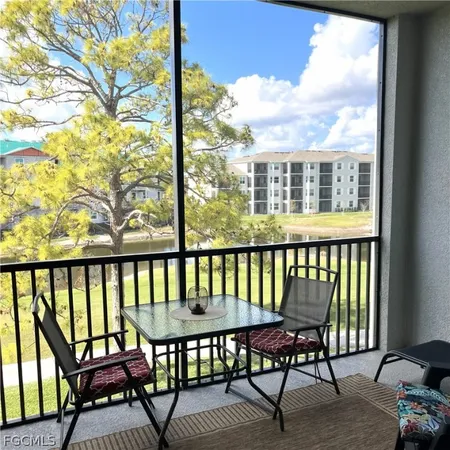 a view of a balcony with chairs