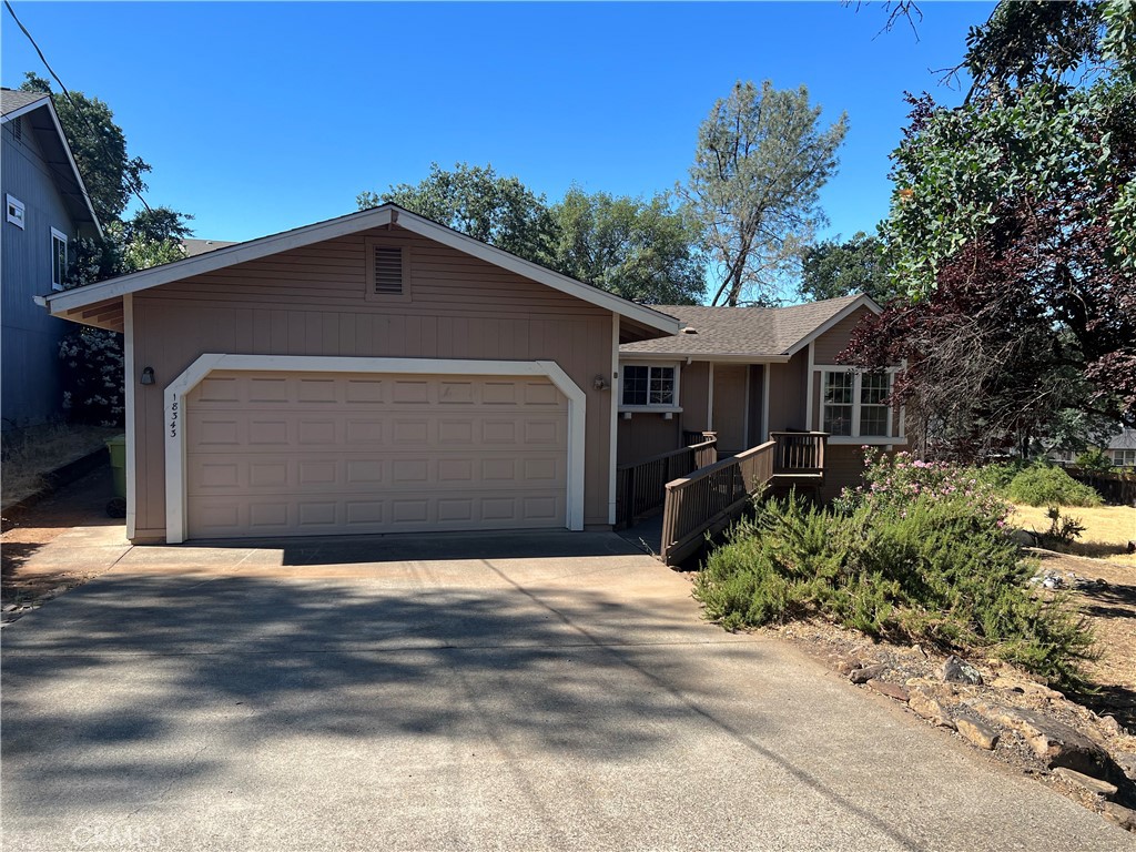 18343 Deer Hill Road Hidden Valley Lake, CA 95467 - Photo 1 of 26 a front view of house with yard and trees in the background