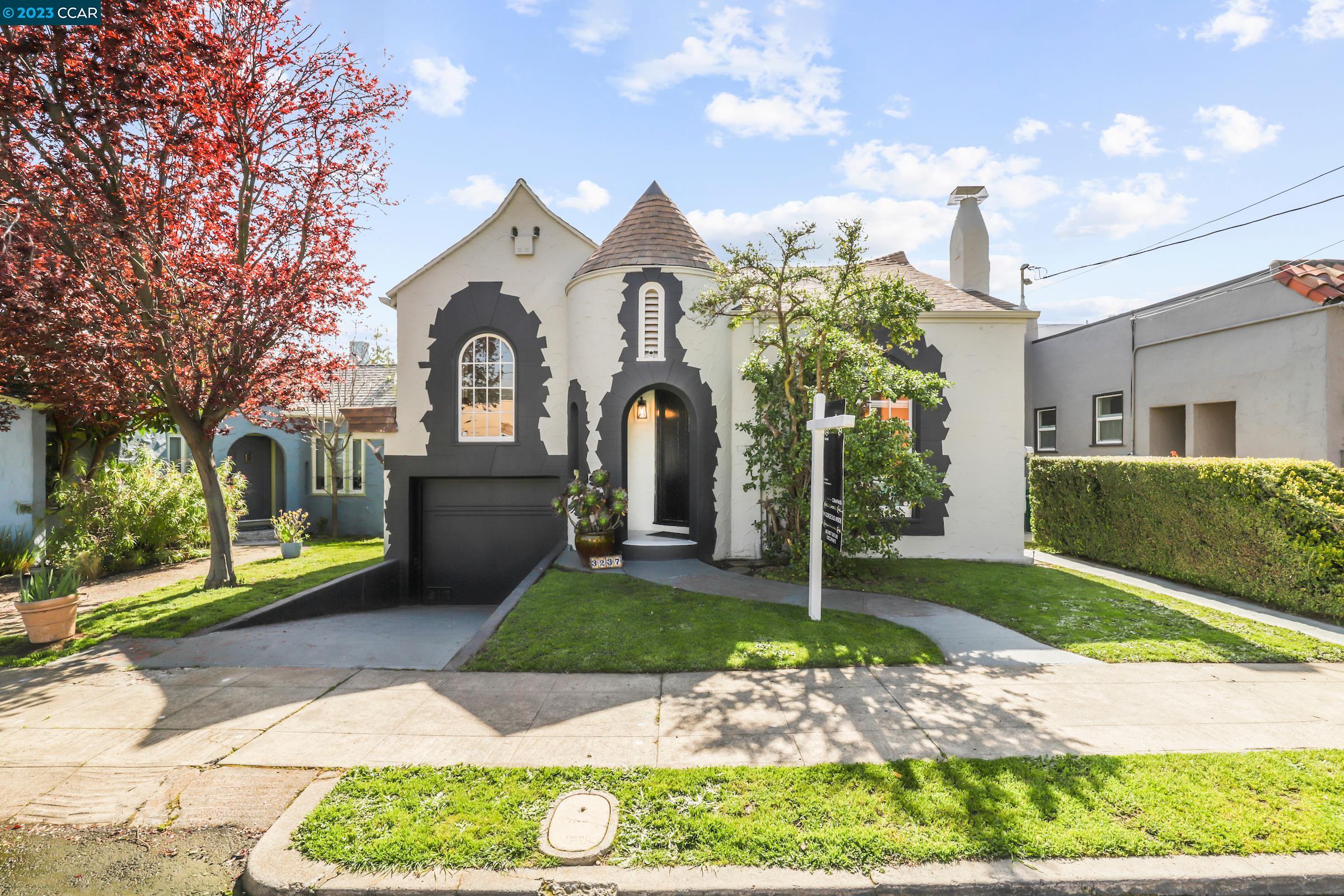 a front view of a house with garden