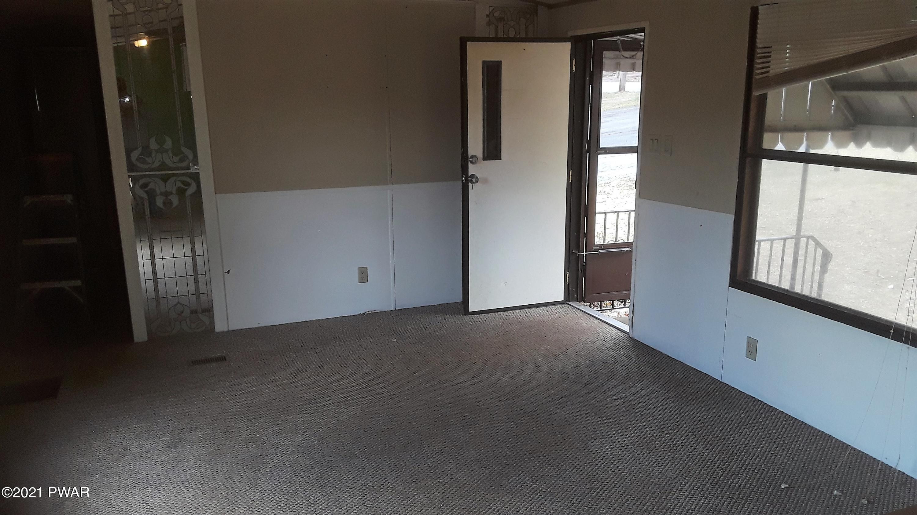 526 Cortez Road Lake Ariel, PA 18436 - Photo 12 of 21 a view of a livingroom with an empty space and a window