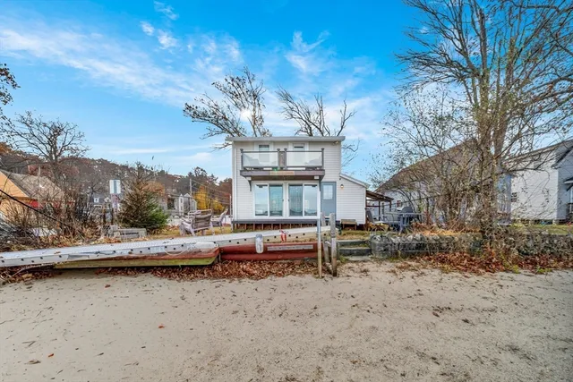 a view of a lake with a house in the background