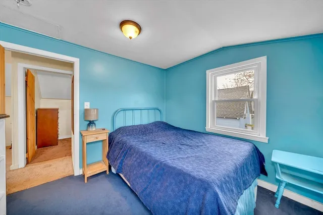 a bedroom with a bed and a cabinets