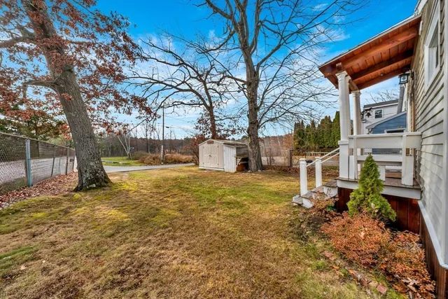 an aerial view of residential houses with outdoor space and river