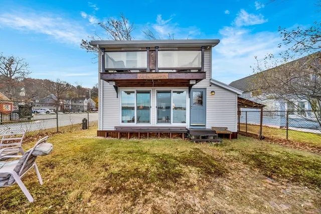 a house with swimming pool in front of it