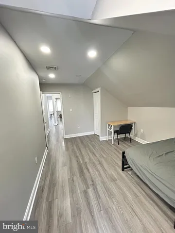 a very nice looking room with wooden floor